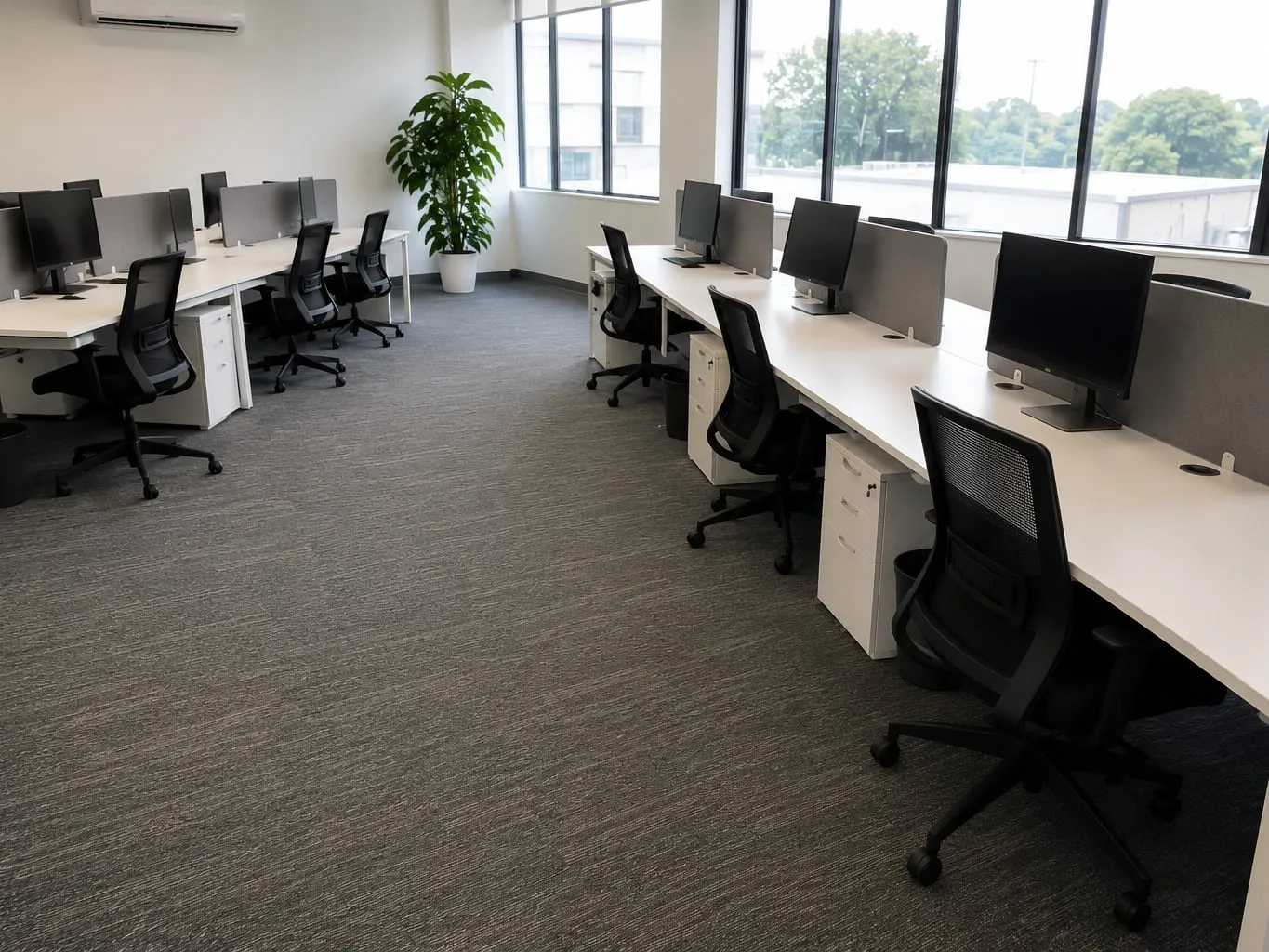 Clean open-plan office with tidy desks